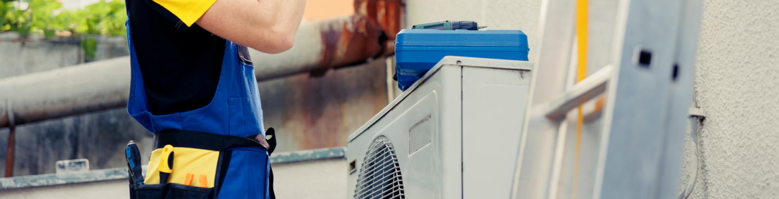 Energy Saver Solutions technician working on a home heating system
